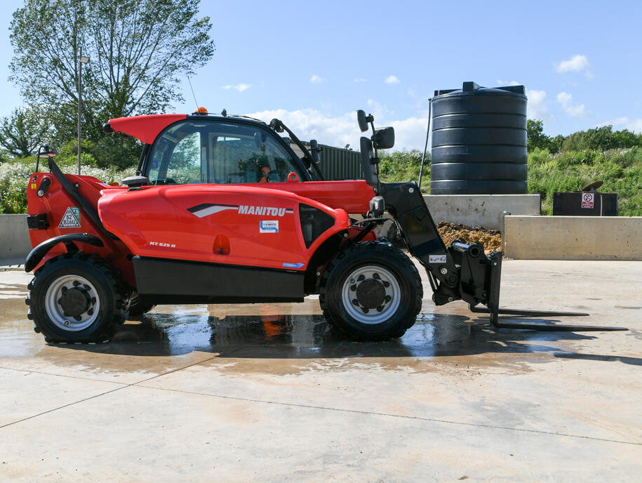Manitou MT625 telehandler on a wash bay