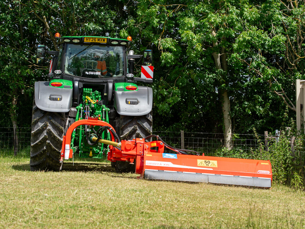 Maschio 2.6m flail giraffa topper rear mounted side arm on a john deere tractor cutting grass
