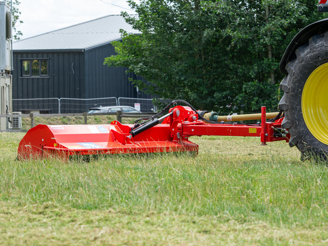Maschio 2.6m flail giraffa topper rear mounted side arm on a john deere tractor cutting grass