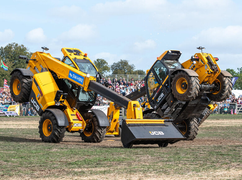 SW-Hire 542-70 AgriPro telehandlers balanced on their front axles in the main ring at Newbury Show