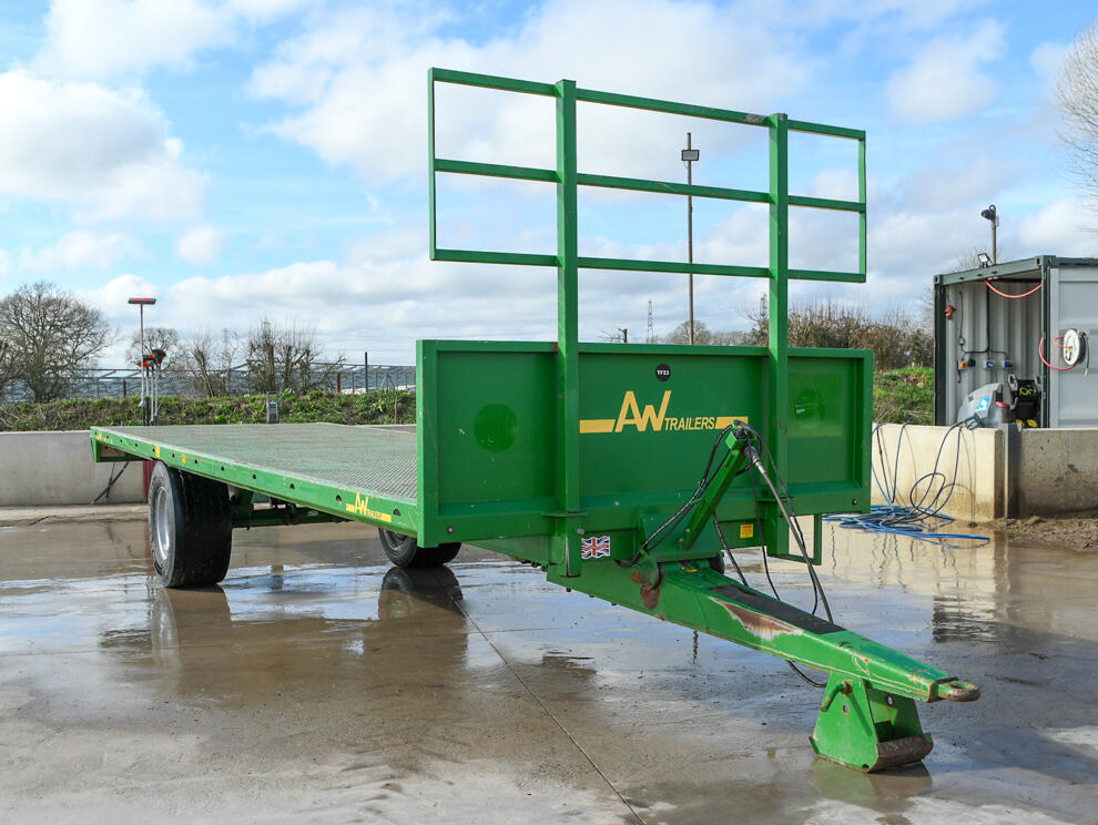 Green 24ft AW Flatbed Trailer on a wash bay