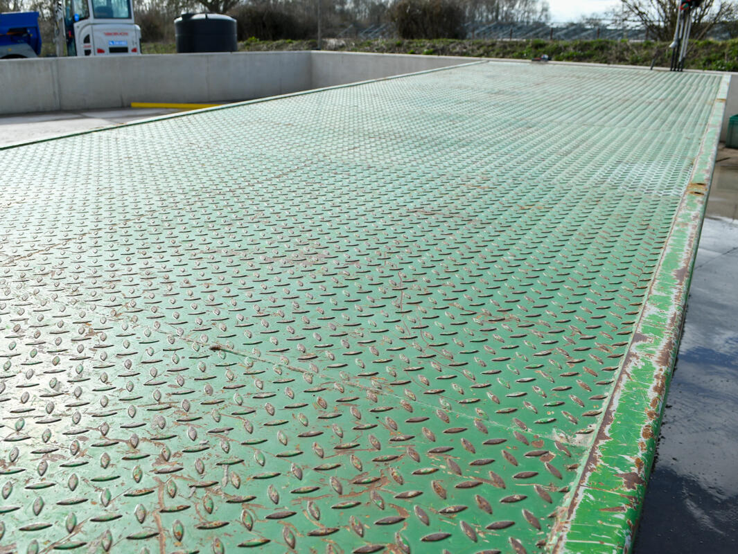 Green 24ft AW Flatbed Trailer on a wash bay