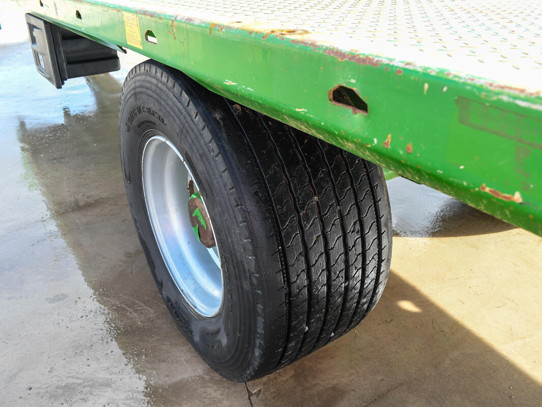 Green 24ft AW Flatbed Trailer on a wash bay
