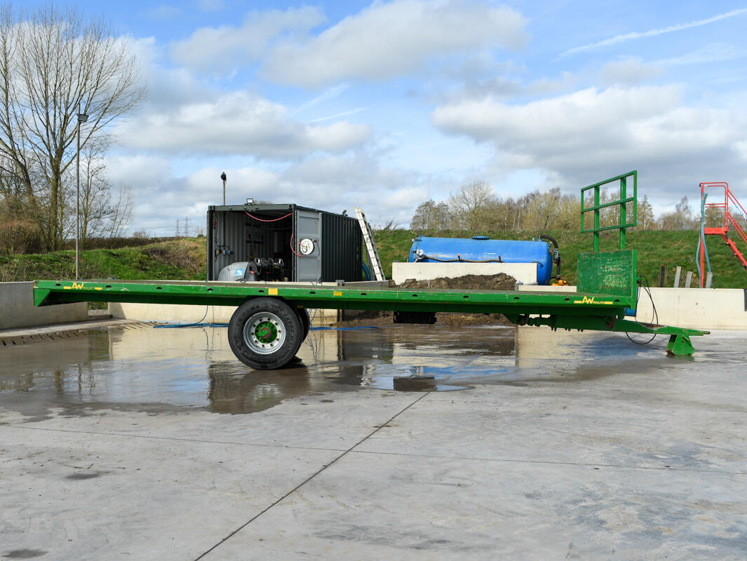 Green 24ft AW Flatbed Trailer on a wash bay