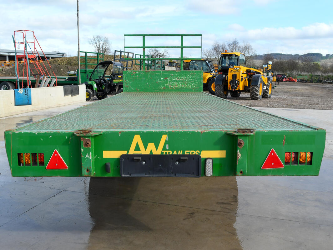 Green 24ft AW Flatbed Trailer on a wash bay
