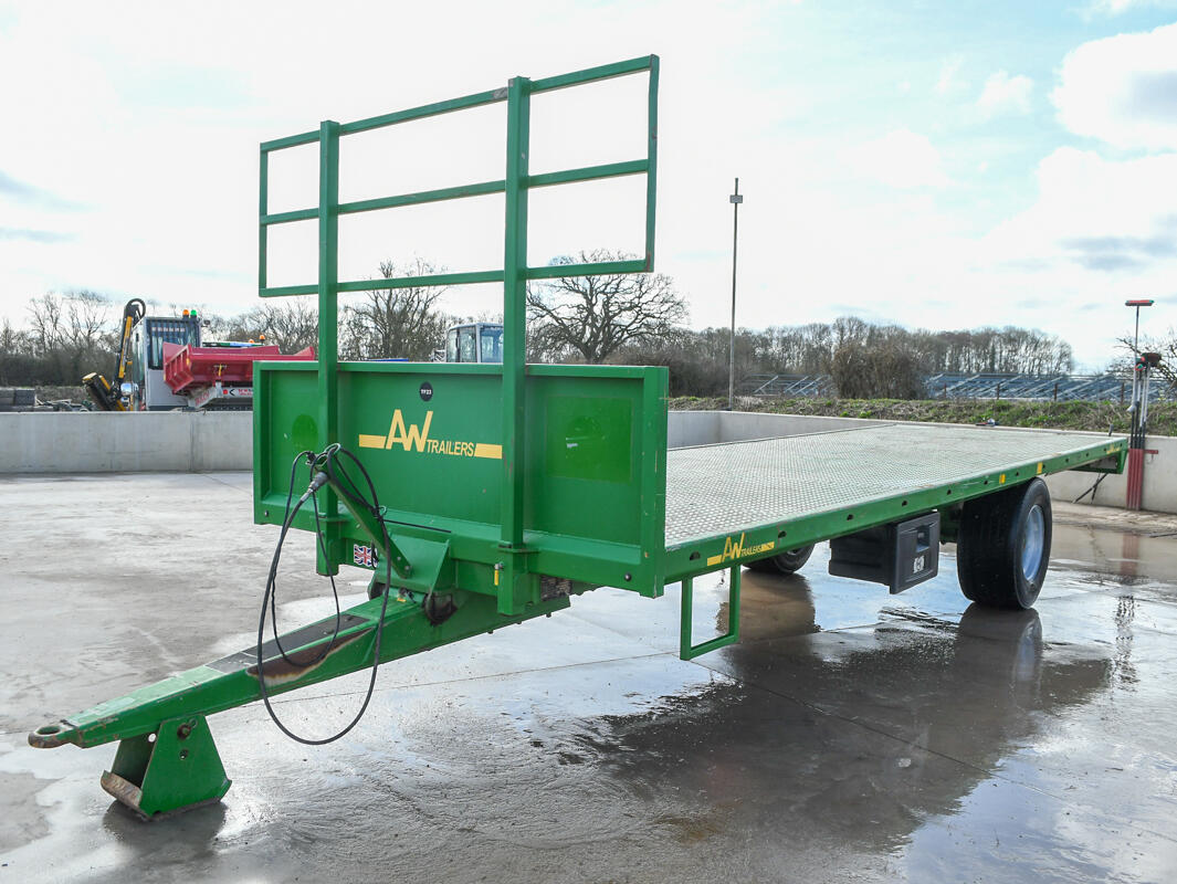 Green 24ft AW Flatbed Trailer on a wash bay
