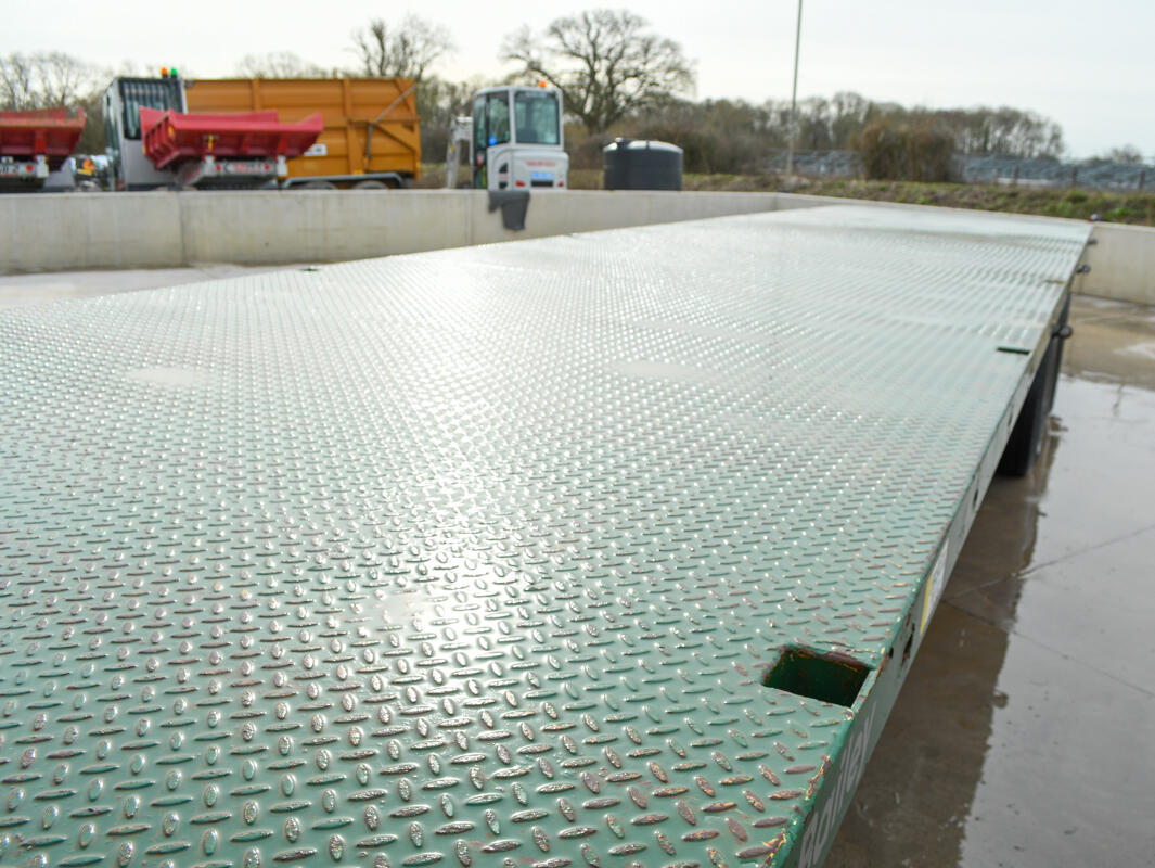36ft Green Bailey Flatbed Trailer on a wash bay