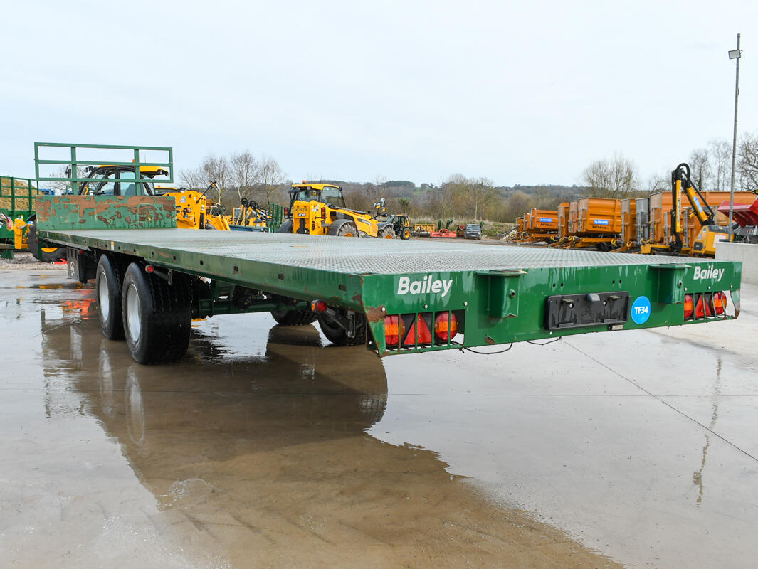 36ft Green Bailey Flatbed Trailer on a wash bay