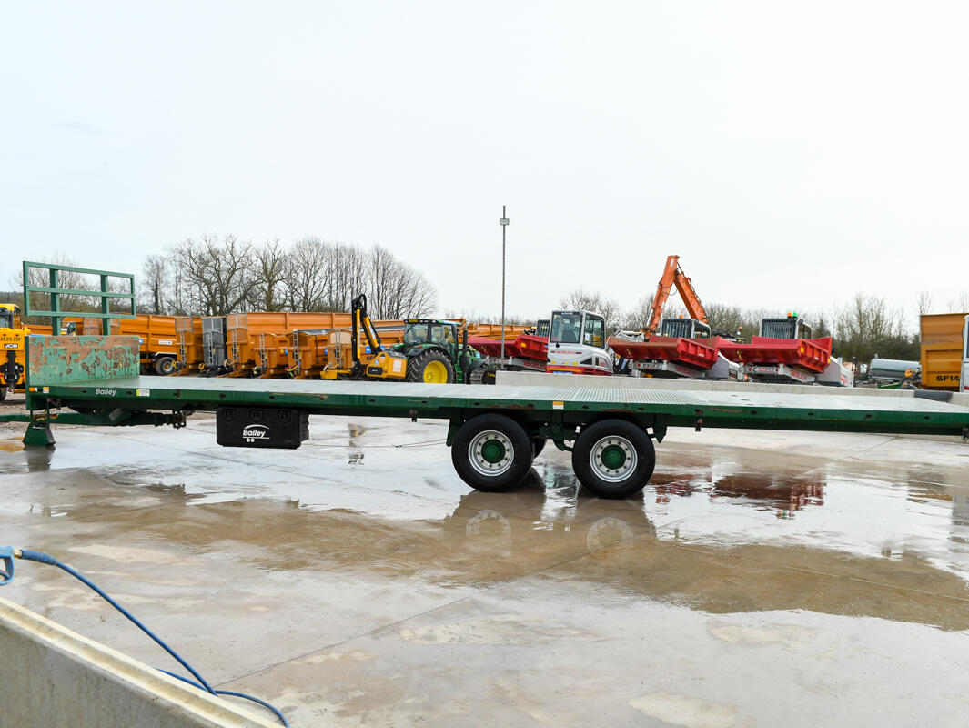 36ft Green Bailey Flatbed Trailer on a wash bay